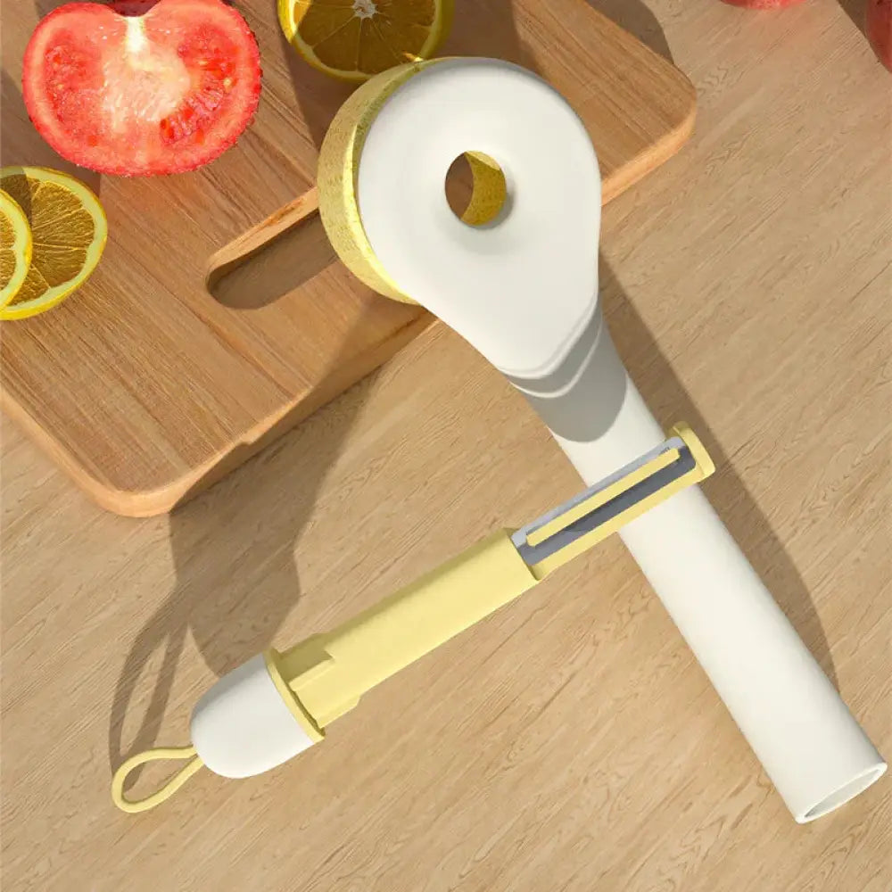 Eco friendly wood pulp kitchen scrub brush with a white and yellow vegetable peeler featuring a looped handle and retractable blade