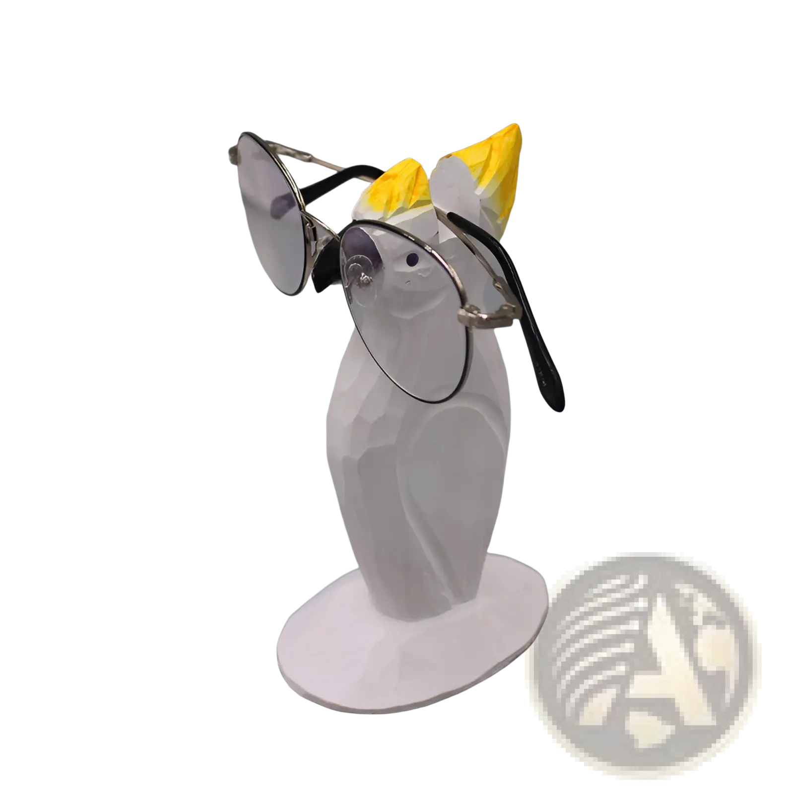 White ceramic owl-shaped glasses holder with yellow crest holding black eyeglass arms for creative home decor