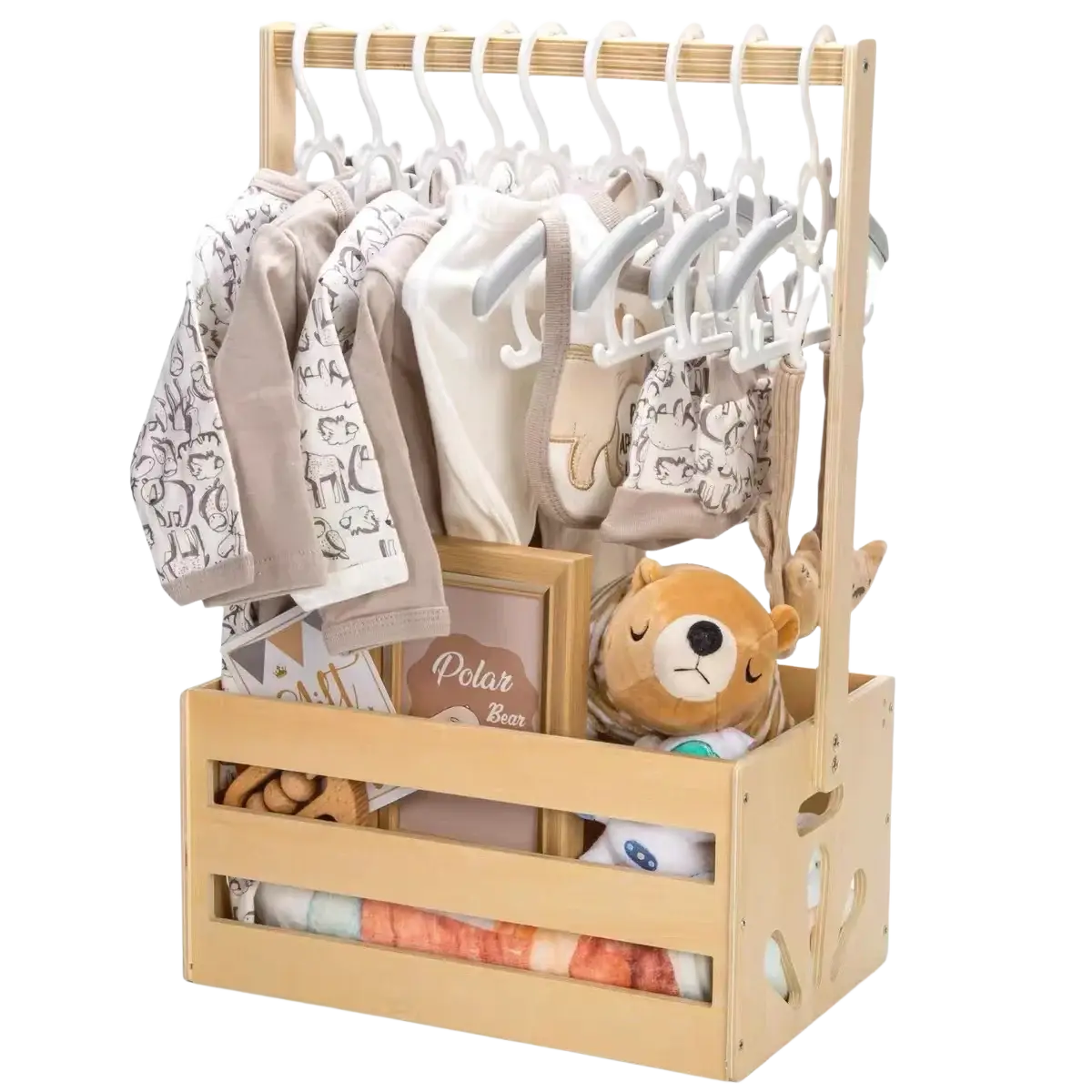Light wood wooden baby toy storage crate and clothing organizer with white hangers holding neutral onesies and a plush bear
