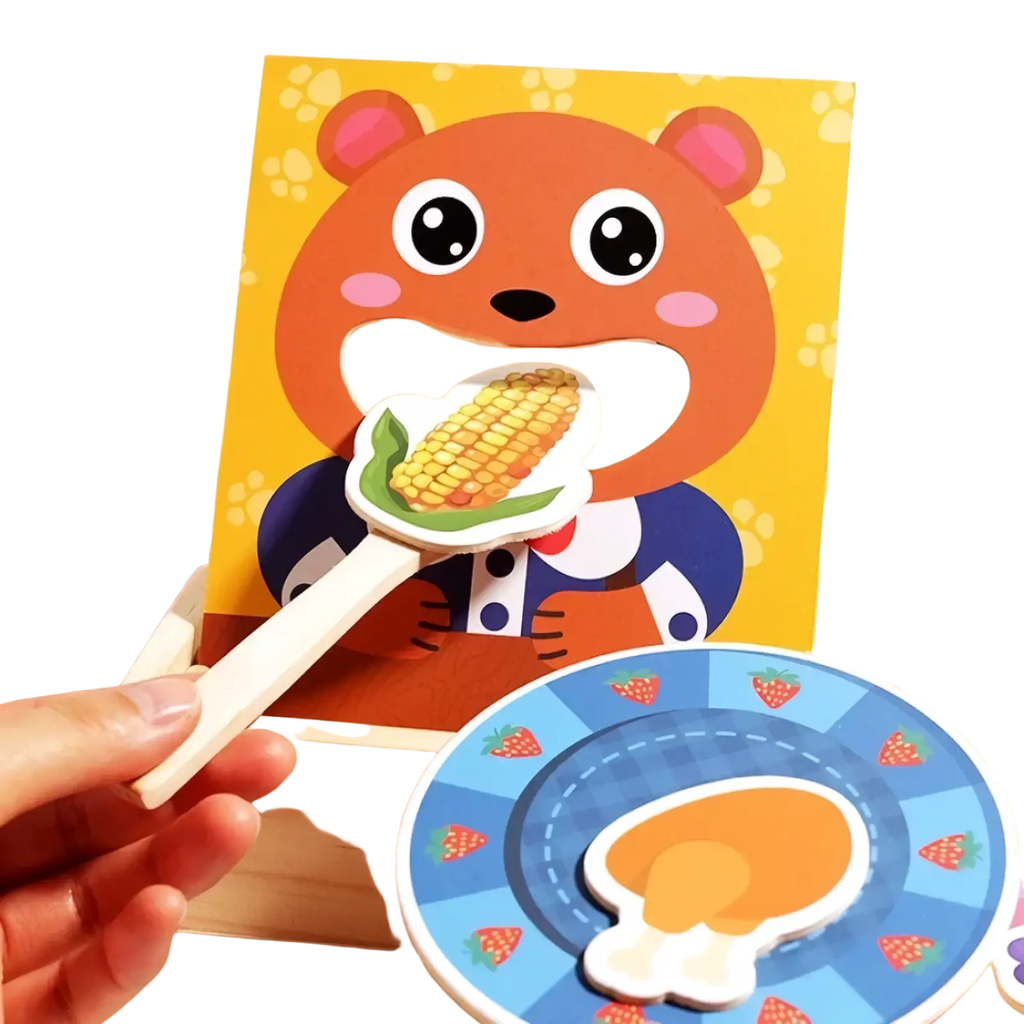 Orange wooden bear feeding game toy holding corn on the cob with pink ears and rosy cheeks in playful puzzle design