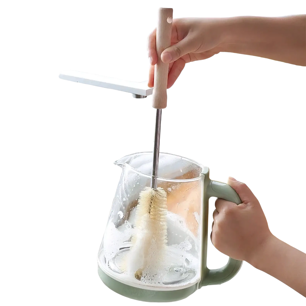 A wooden bottle cleaning brush with a long wooden handle and bristles cleaning a clear glass kettle with a green handle