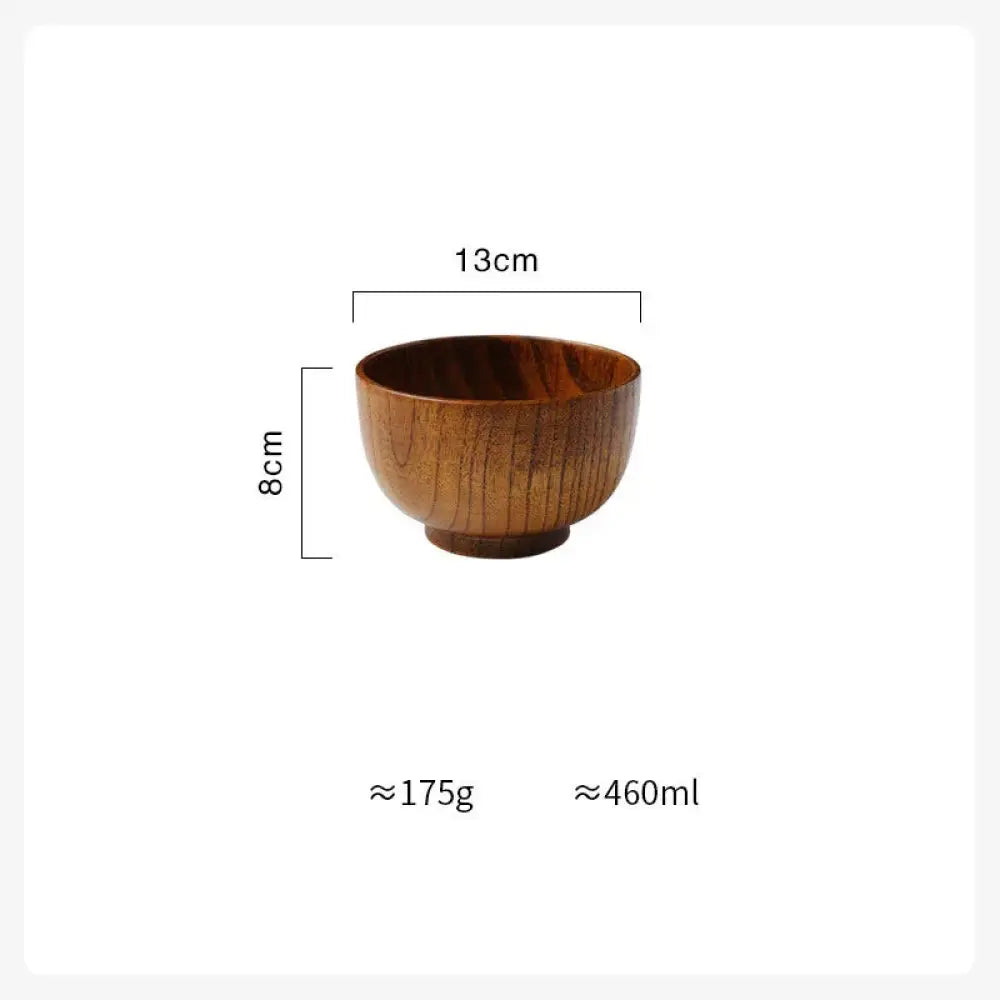 A smooth medium brown handcrafted Japanese style natural wooden bowl with natural grain pattern and rounded edges