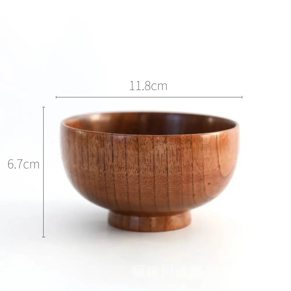 Handcrafted Japanese style natural wooden bowl with a smooth medium brown finish and subtle vertical grain patterns