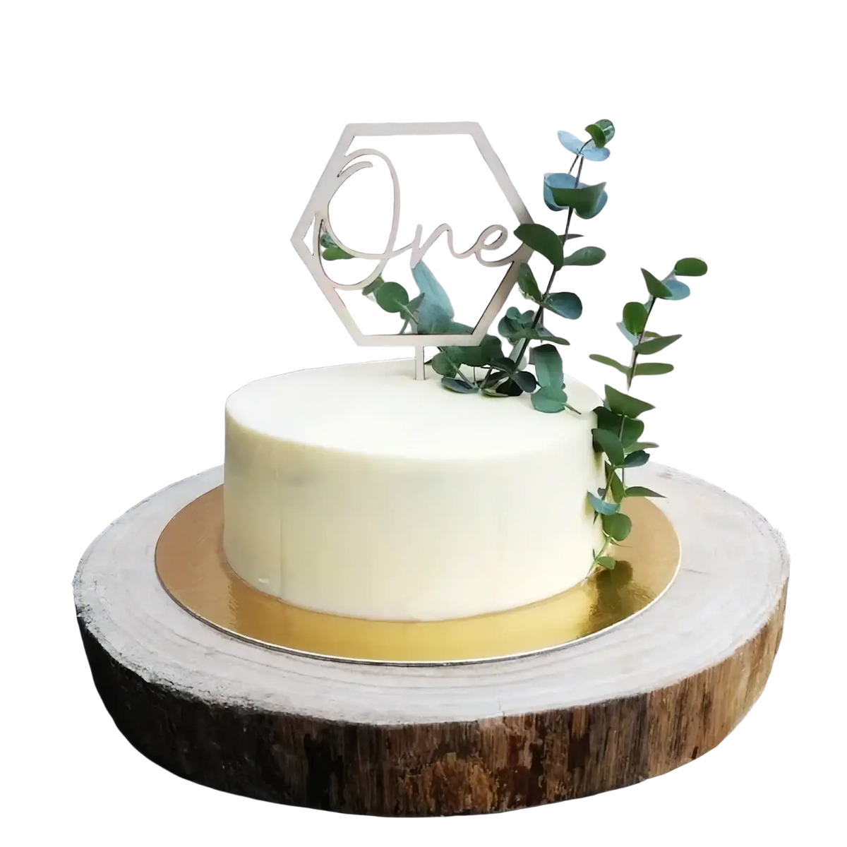 A sleek off-white frosted cake with a wooden hexagonal one cake topper and fresh green eucalyptus sprigs