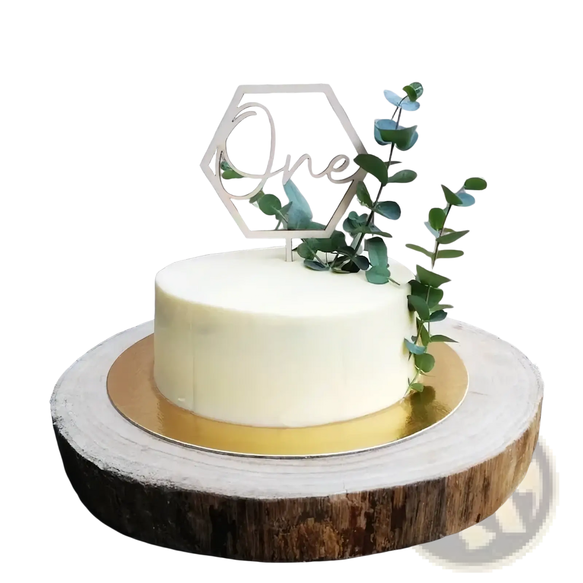 A sleek off-white frosted cake with a wooden hexagonal one cake topper and fresh green eucalyptus sprigs