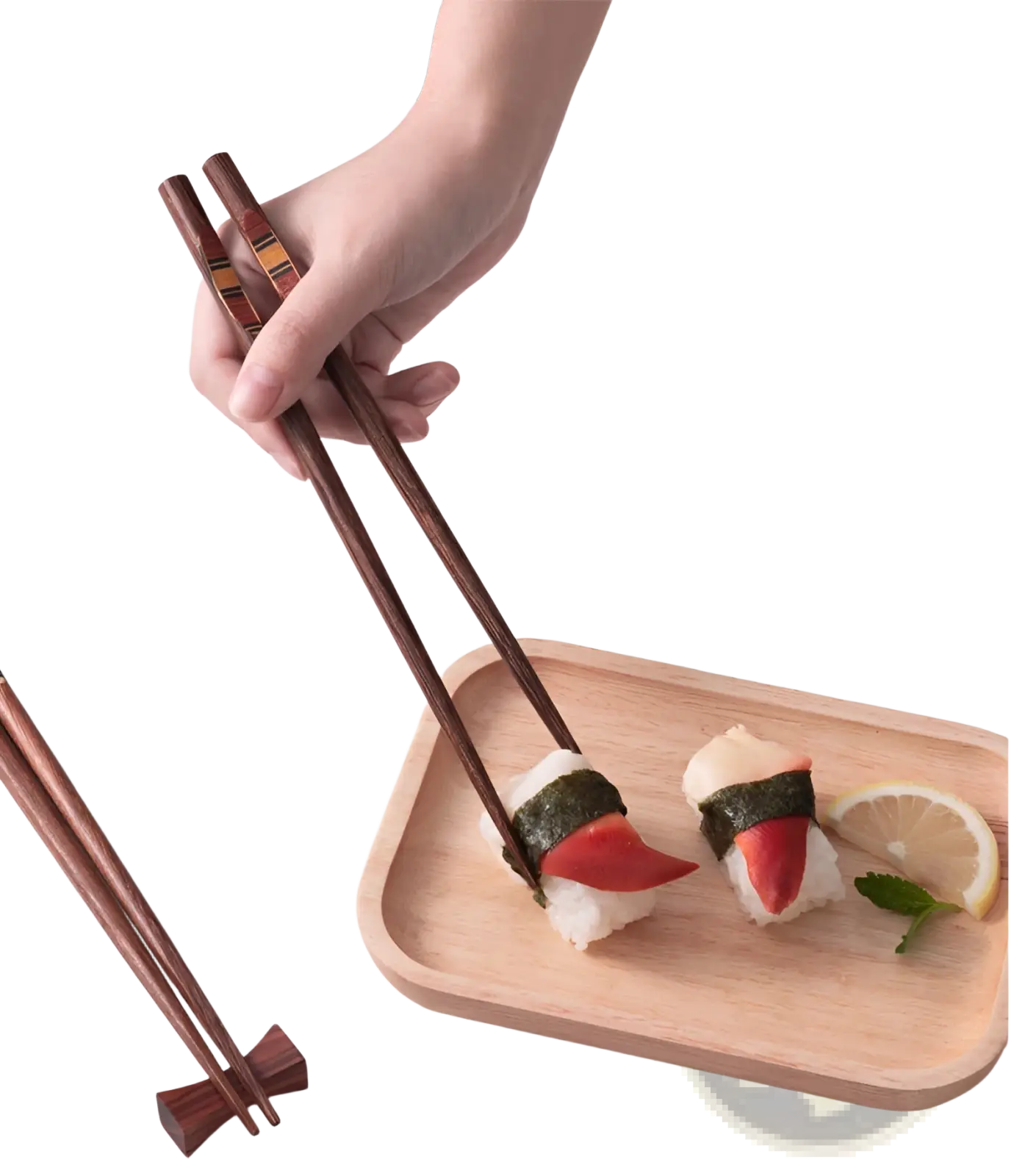 Dark brown wooden chopsticks set with non slip tips featuring a subtle striped pattern held above sushi tray