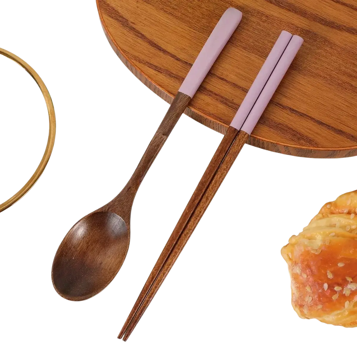A wooden chopsticks and spoon set with lavender silicone handles and smooth natural wood grain finishes