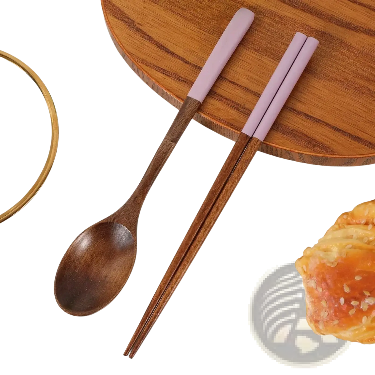 A wooden chopsticks and spoon set with lavender silicone handles and smooth natural wood grain finishes