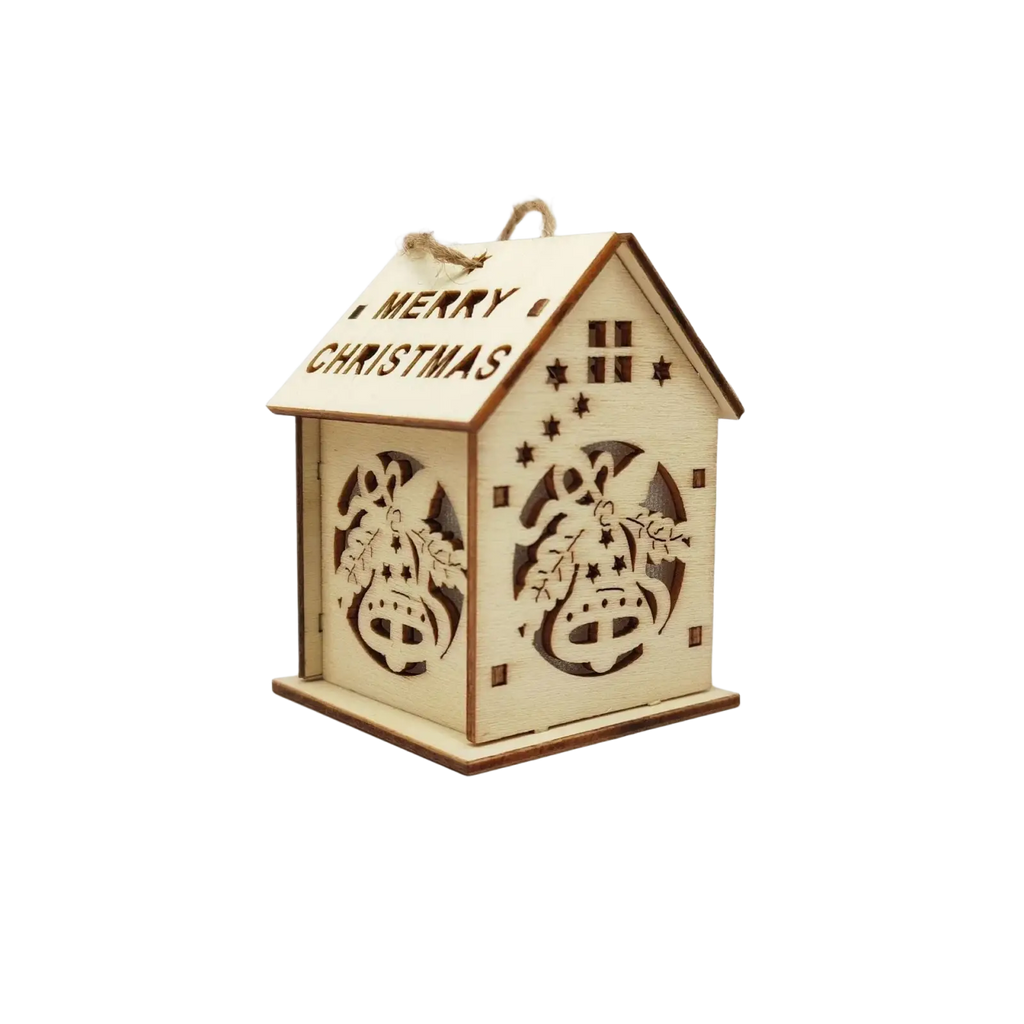 A light-colored wooden christmas house led lantern with laser-cut bells stars and merry christmas on the roof