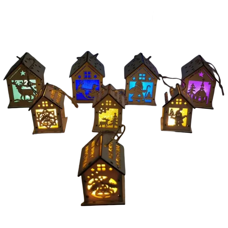 Wooden christmas house led lanterns with intricate cut-out designs and glowing interiors in various colors
