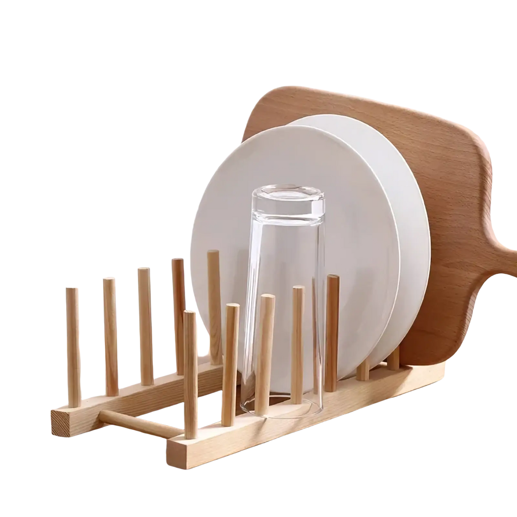 Light-colored wooden dish drying rack with vertical slats holding a white plate and clear glass for plate organization