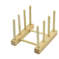 Light-colored wooden dish drying rack and plate organizer with eight vertical slots and minimalist design