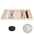 Light-colored wooden fast sling puck game desktop ice hockey board with black and white discs marked winner in red text