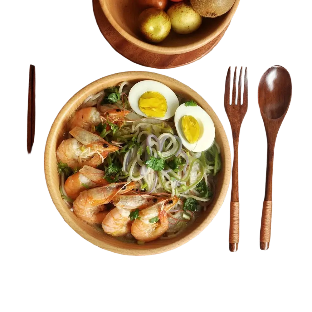 Wooden flatware set with portable eco-friendly cutlery displayed beside a wooden bowl of shrimp noodles and halved eggs