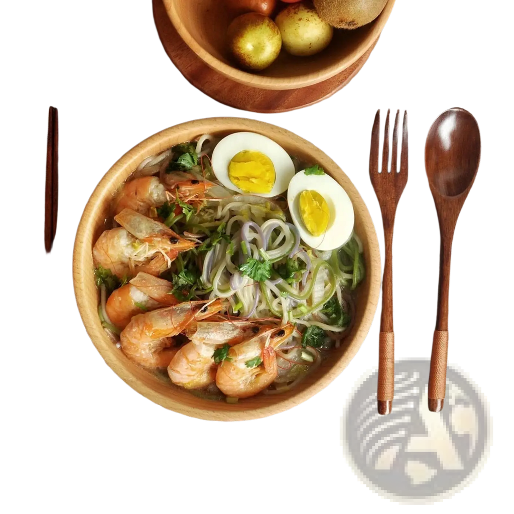 Wooden flatware set with portable eco-friendly cutlery displayed beside a wooden bowl of shrimp noodles and halved eggs