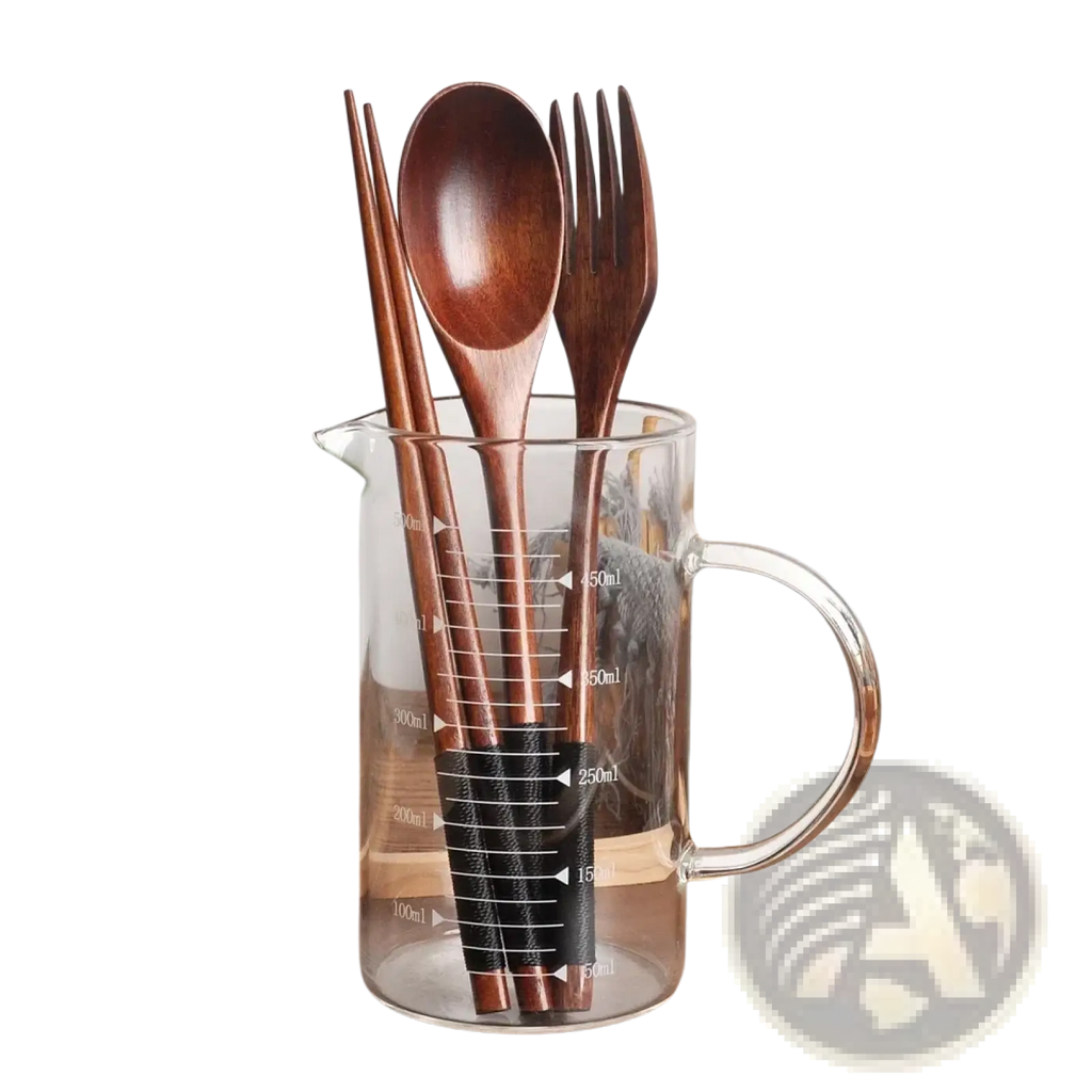 Set of brown wooden utensils in a clear glass measuring jug portable eco-friendly flatware cutlery set