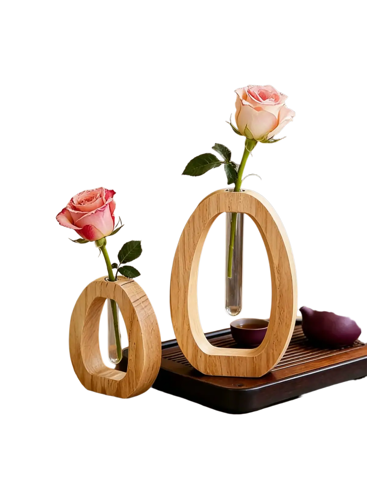 Two minimalist wooden oval vases with clear glass tubes each holding a single pink rose for desk decor