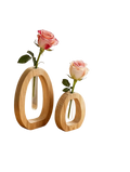 Two minimalist wooden glass bud vases with clear tubes each holding a single pink rose for desk decor