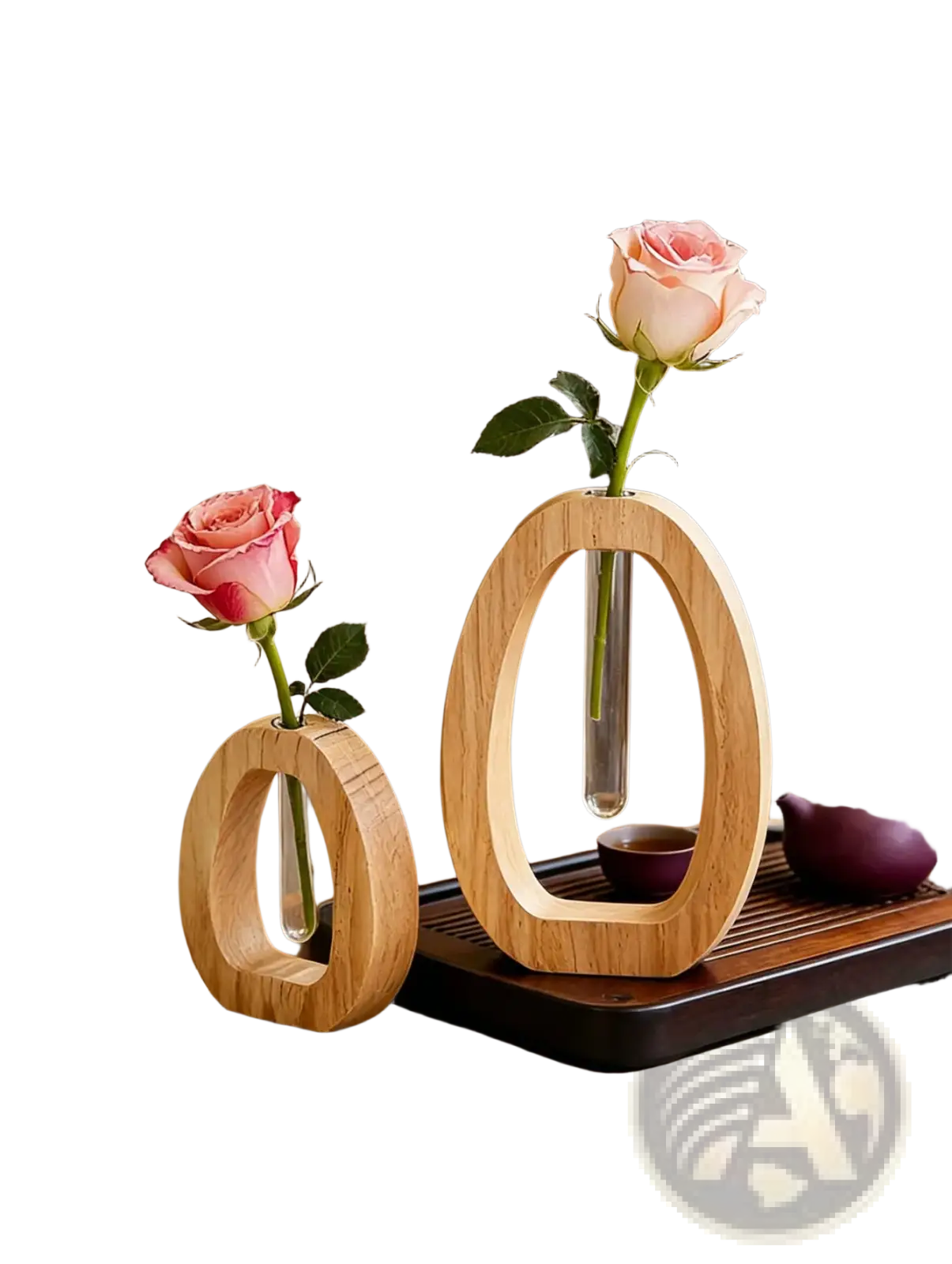 Two minimalist wooden oval vases with clear glass tubes each holding a single pink rose for desk decor