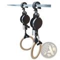 Black and silver adjustable wooden gymnastics rings with light wooden handles and numbered straps hanging from a metal bar