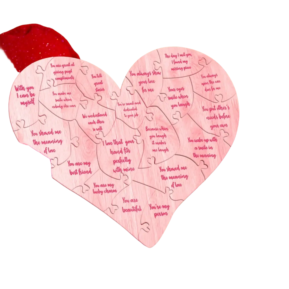 Pink wooden heart puzzle with engraved romantic messages designed as valentine decor centerpiece
