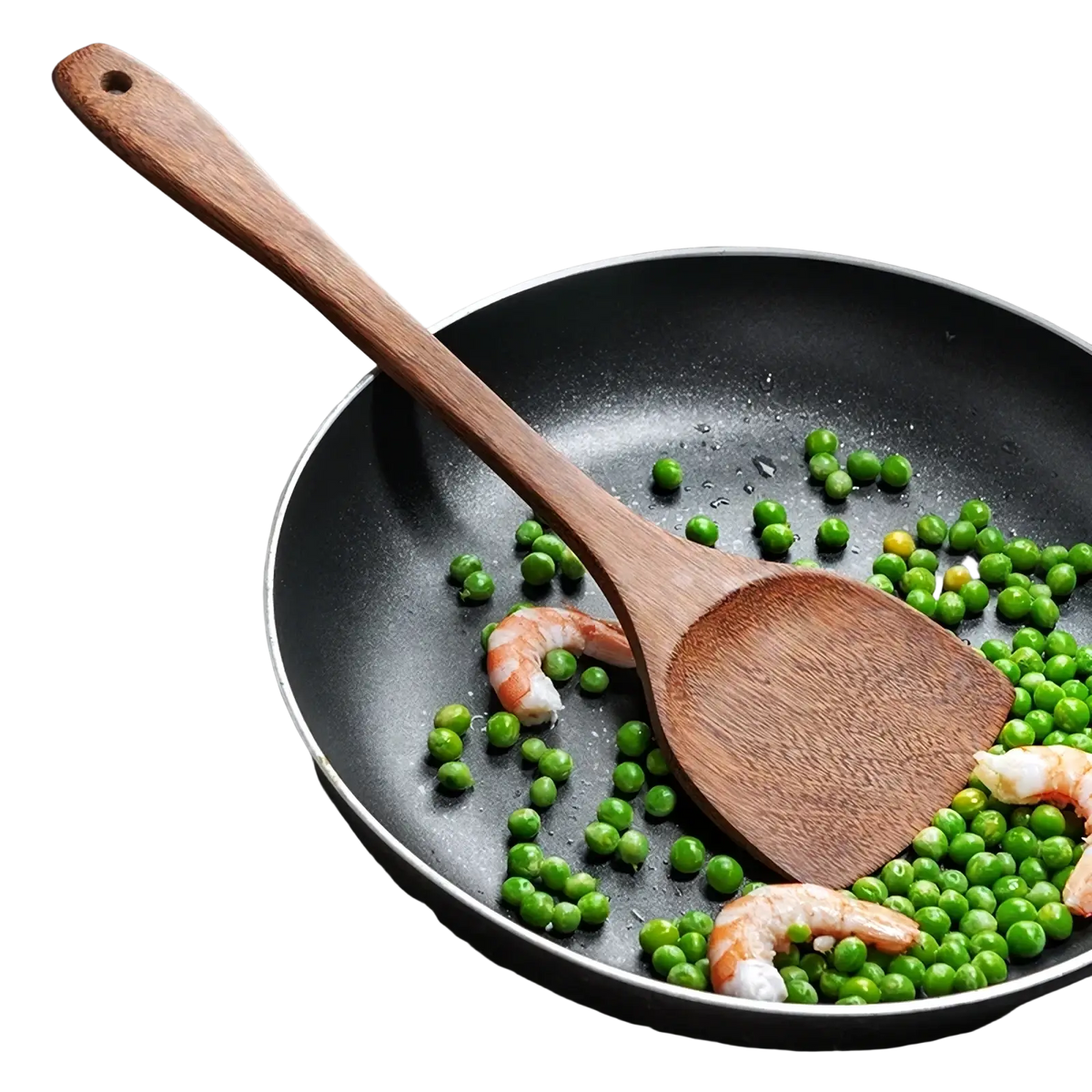 A wooden kitchen spatula with a smooth finish and curved handle resting in a black non-stick frying pan