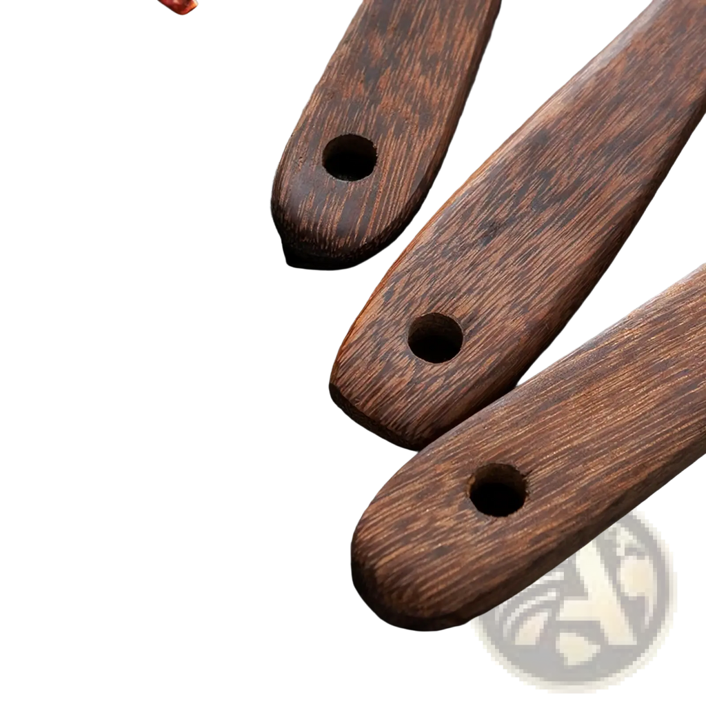 Three dark brown wooden utensil handles with polished finish and natural grain for non-stick cookware use