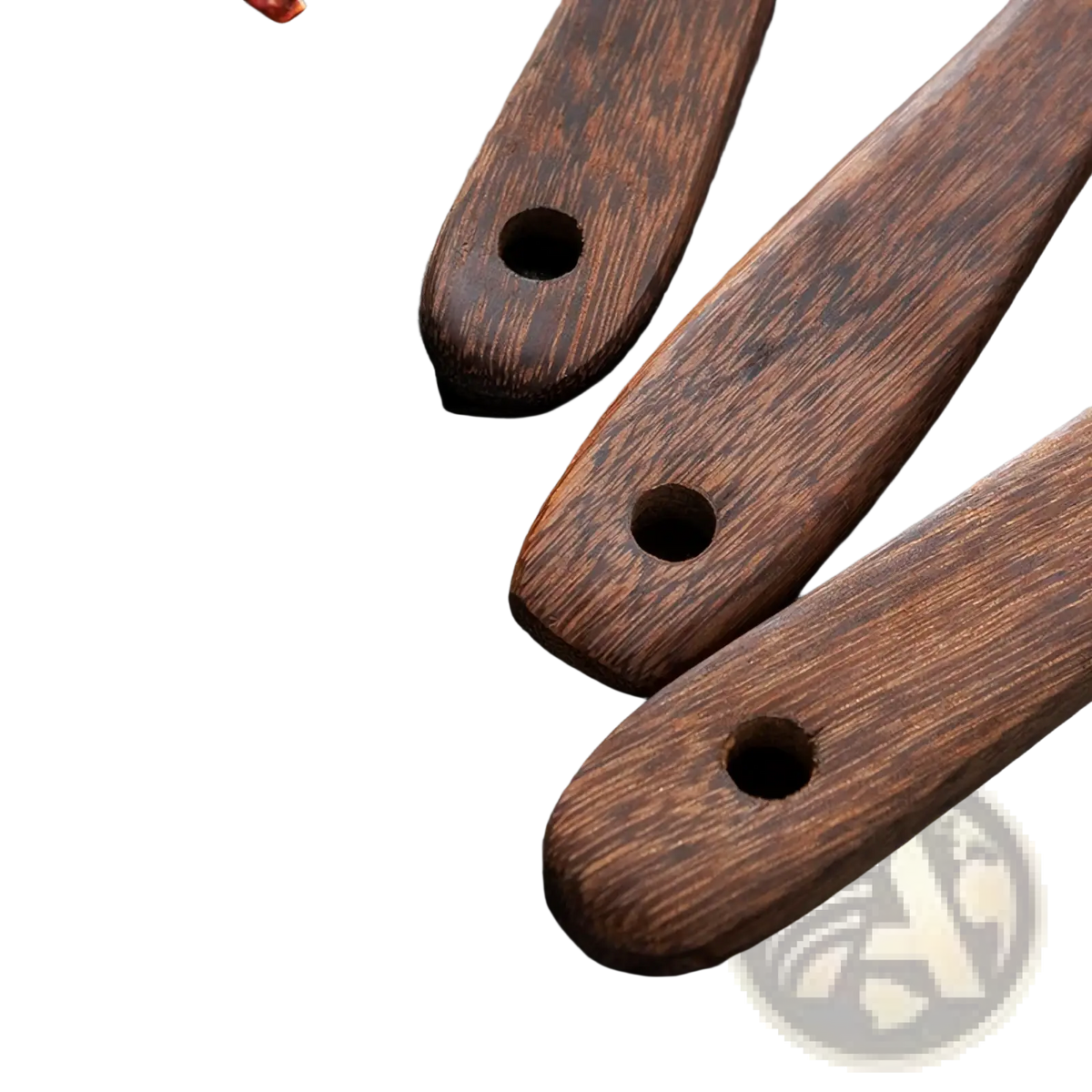 Three dark brown wooden utensil handles with polished finish and natural grain for non-stick cookware use