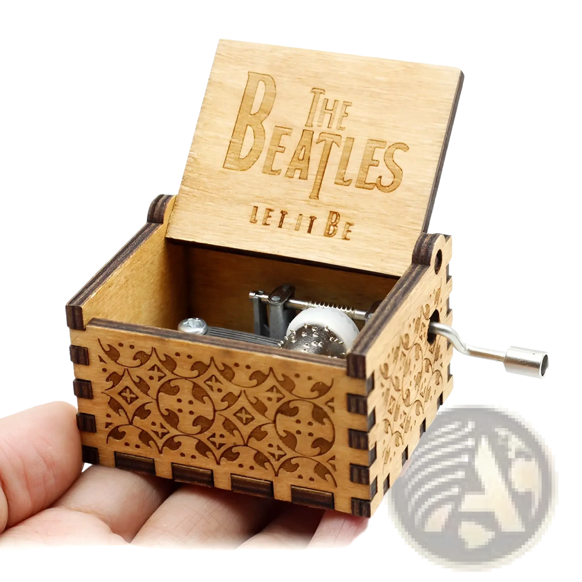 Wooden music box with hand crank featuring light wood, dark brown engraved patterns, and the beatles let it be inscription