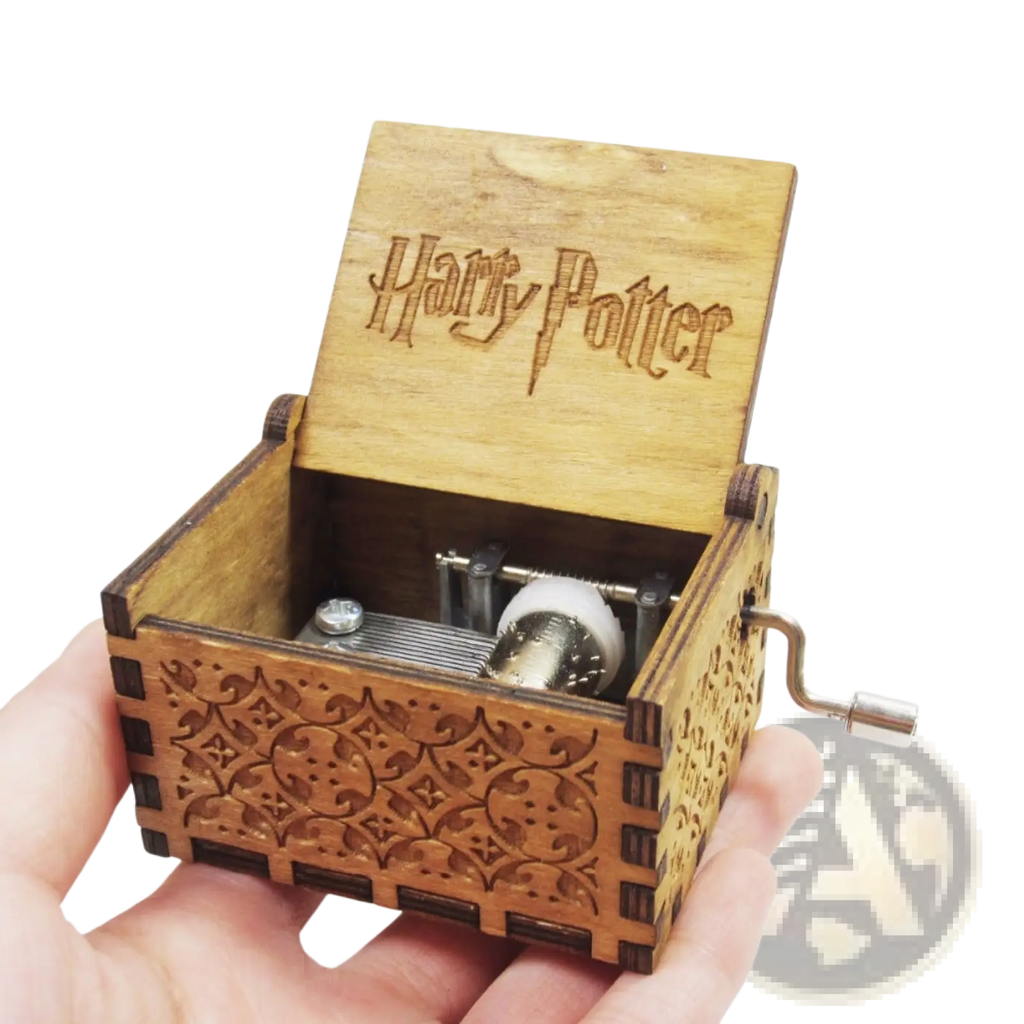 Wooden harry potter music box with intricate carvings and hand crank mechanism in natural wood finish