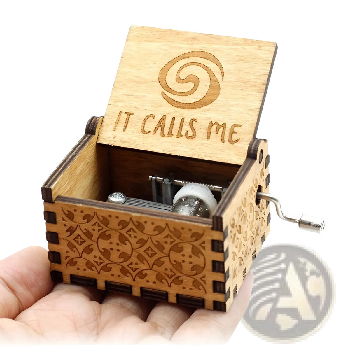 Wooden music box with hand crank featuring light brown finish and carved it calls me spiral design on lid
