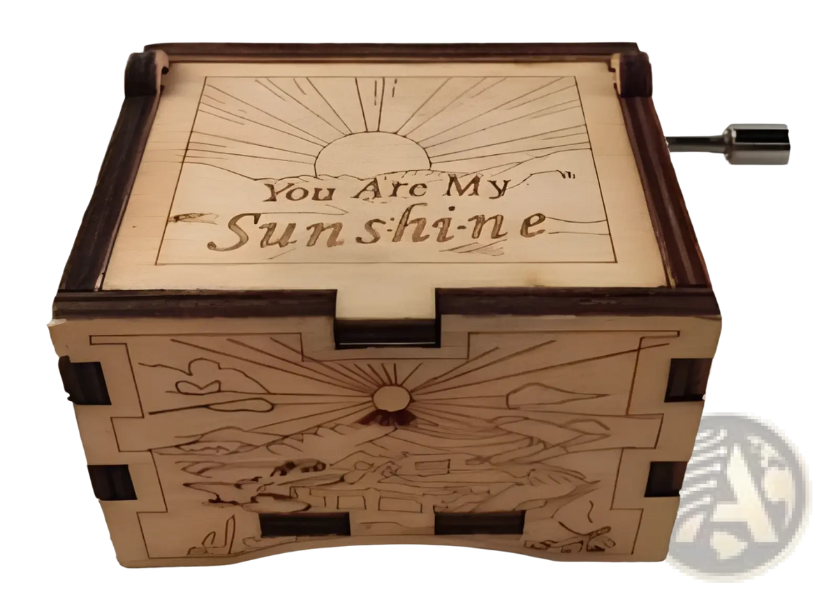 Wooden music box with hand crank carved themes in light wood with dark brown trim and engraved you are my sunshine design