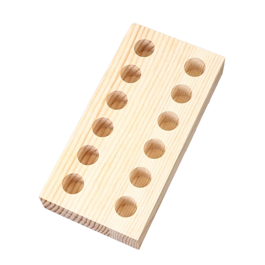 Light-colored wooden pliers holder pegboard with evenly spaced circular holes for tool organization