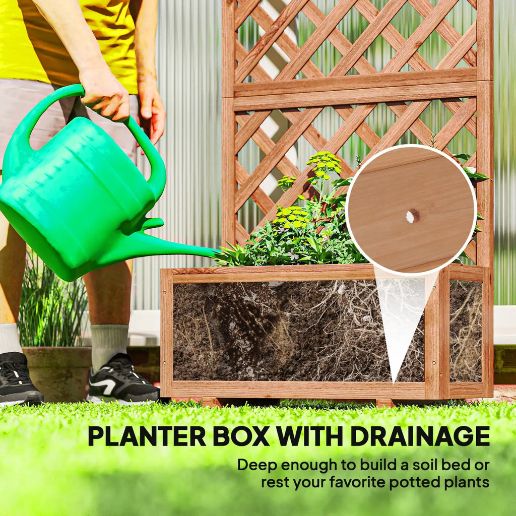 Green plastic watering can next to a wooden raised garden bed with trellis planter box for gardening use