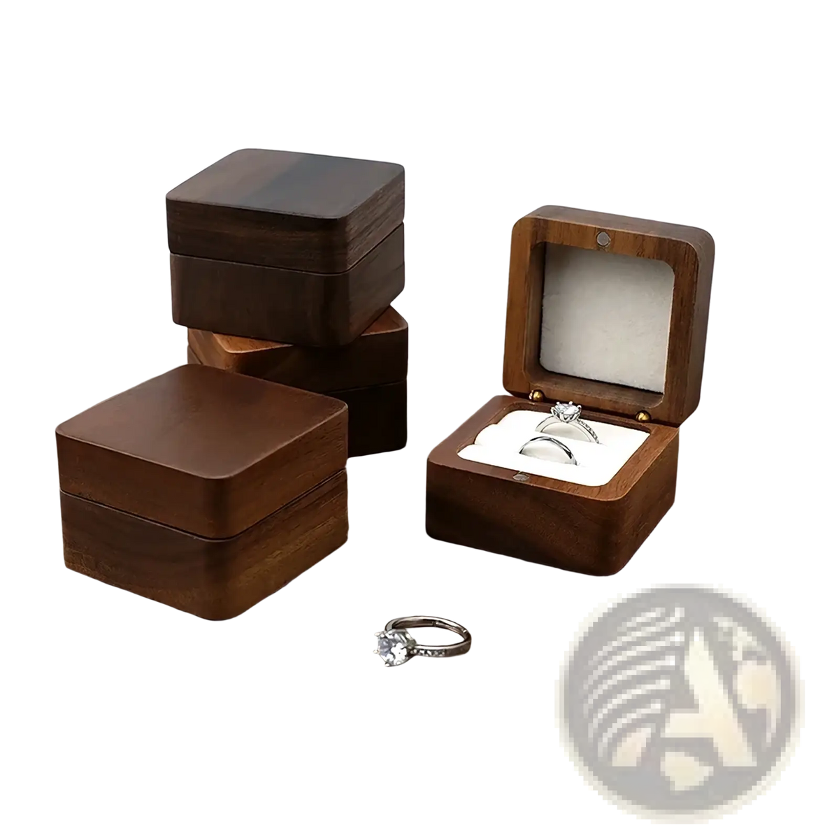 Dark brown wooden ring box with square design and white interior open to display two rings for engagement proposals
