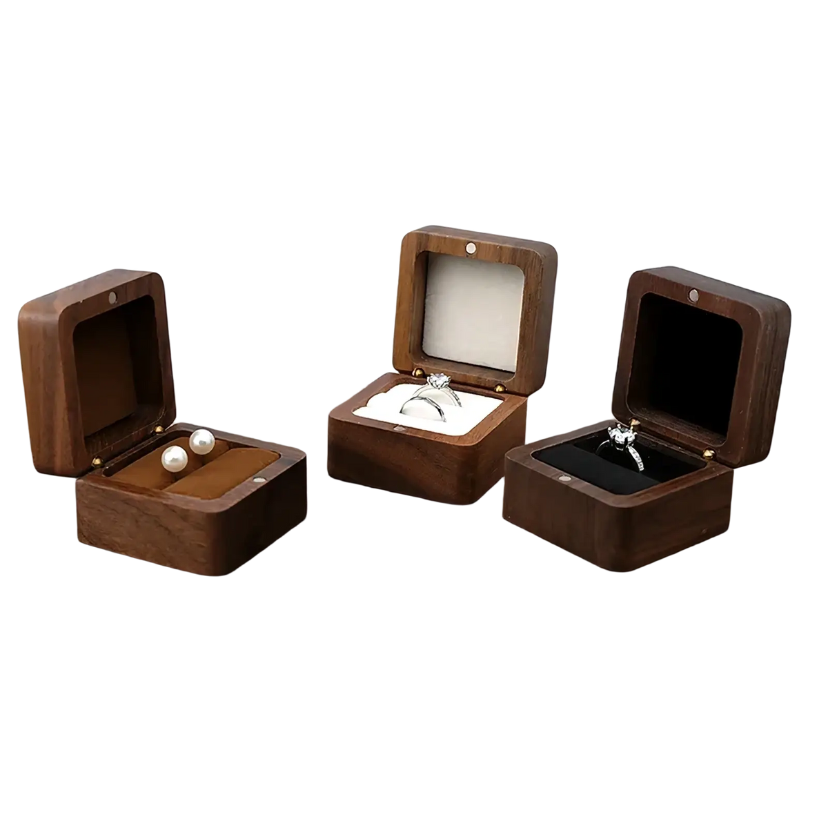 Three dark brown wooden ring box proposal engagement holders open to display rings and pearls