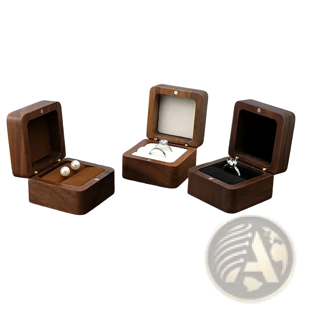 Three dark brown wooden ring box proposal engagement holders open to display rings and pearls