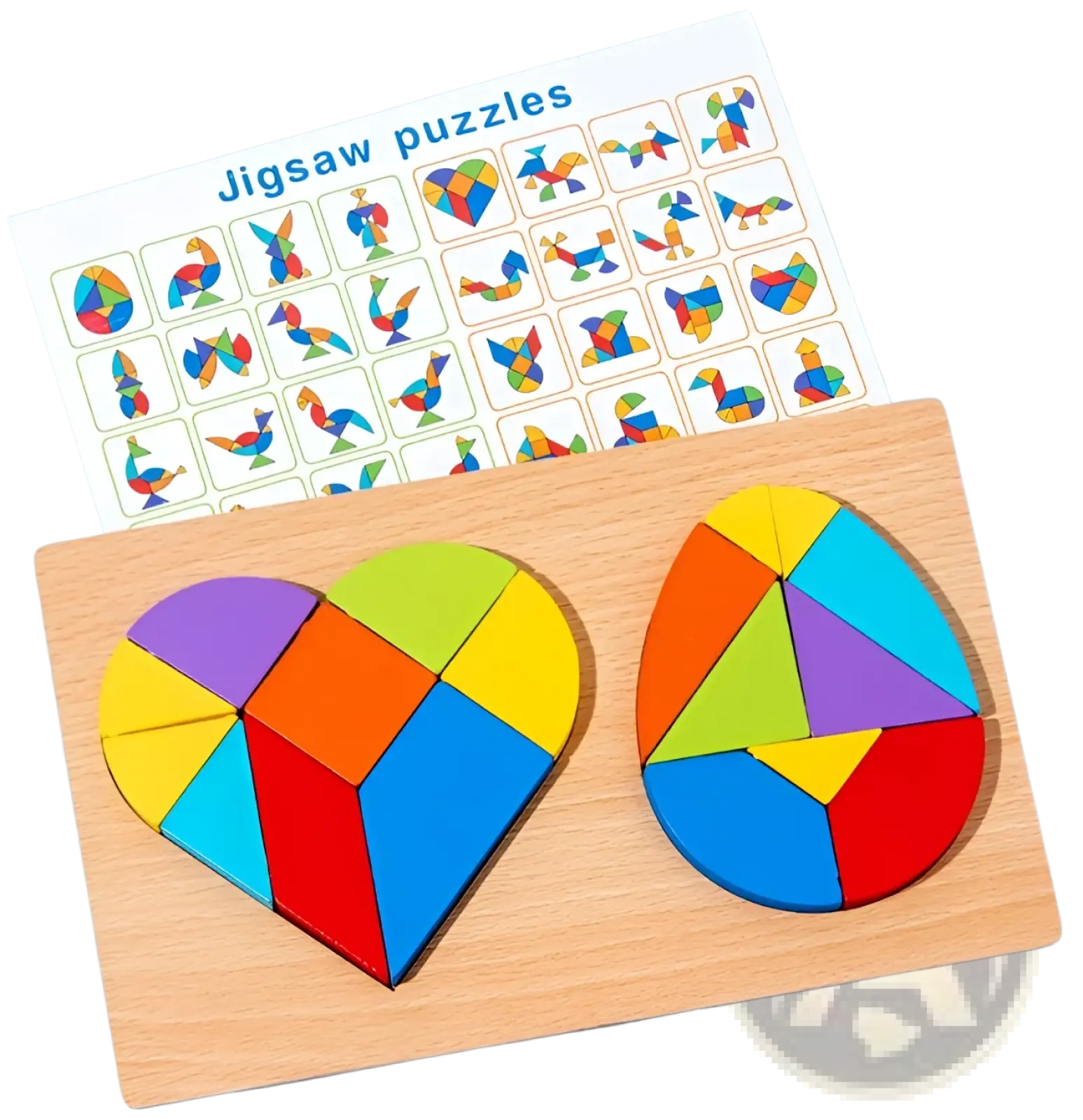 Colorful wooden tangram puzzle pieces arranged in heart and egg shapes on a light wood board for kids toy play
