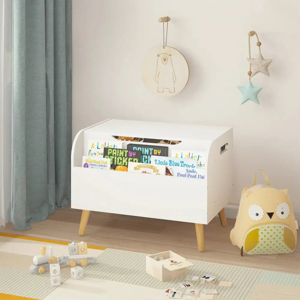 White wooden toy box and bookshelf bench with safety hinge and colorful children’s books on front panel
