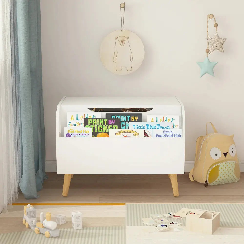 White wooden toy box and bookshelf bench with safety hinge featuring wooden legs and colorful books in open compartments