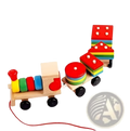 Wooden train stacking toy with colorful circular blocks on each car and a red string attached to the front