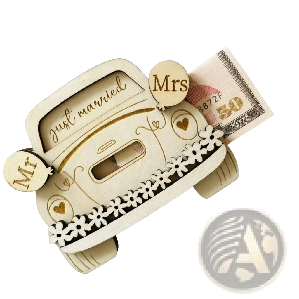A light-colored wooden wedding car money box with just married engraving and white flower cutouts on the side