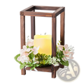 Dark brown wooden wedding lantern centerpiece with glowing LED candle and pink green artificial flowers