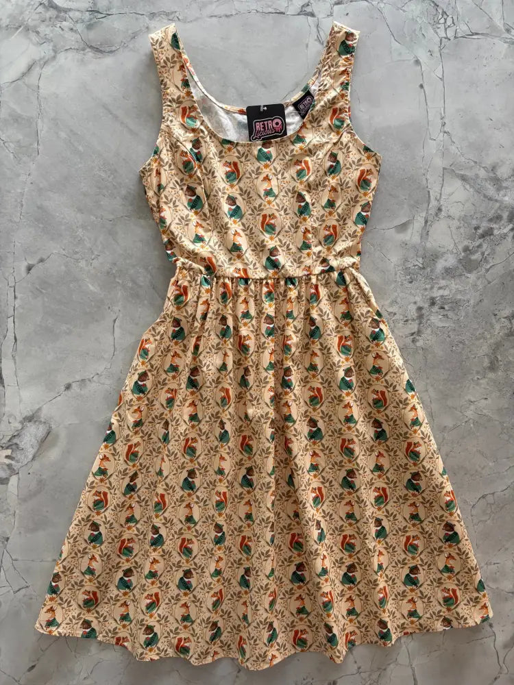 Woodland scout vintage cotton fit and flare dress sleeveless beige with red and green squirrel pattern on light background