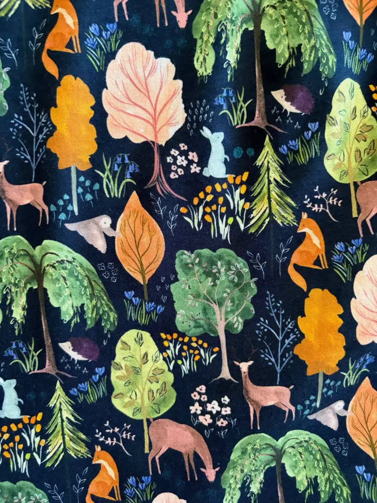 Woodland navy cotton 1950s vintage sleeveless dress with pockets featuring dark blue fabric and whimsical forest animal pattern