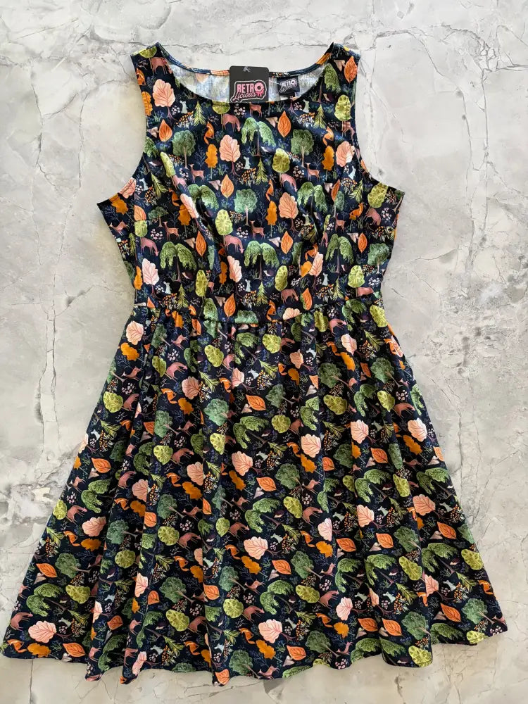 Sleeveless dark navy cotton dress with green and orange leaf pattern 1950s vintage style with pockets
