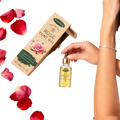 A clear glass bottle with a gold-toned dropper cap containing golden-yellow woodsleep yoni oil for vaginal tightening