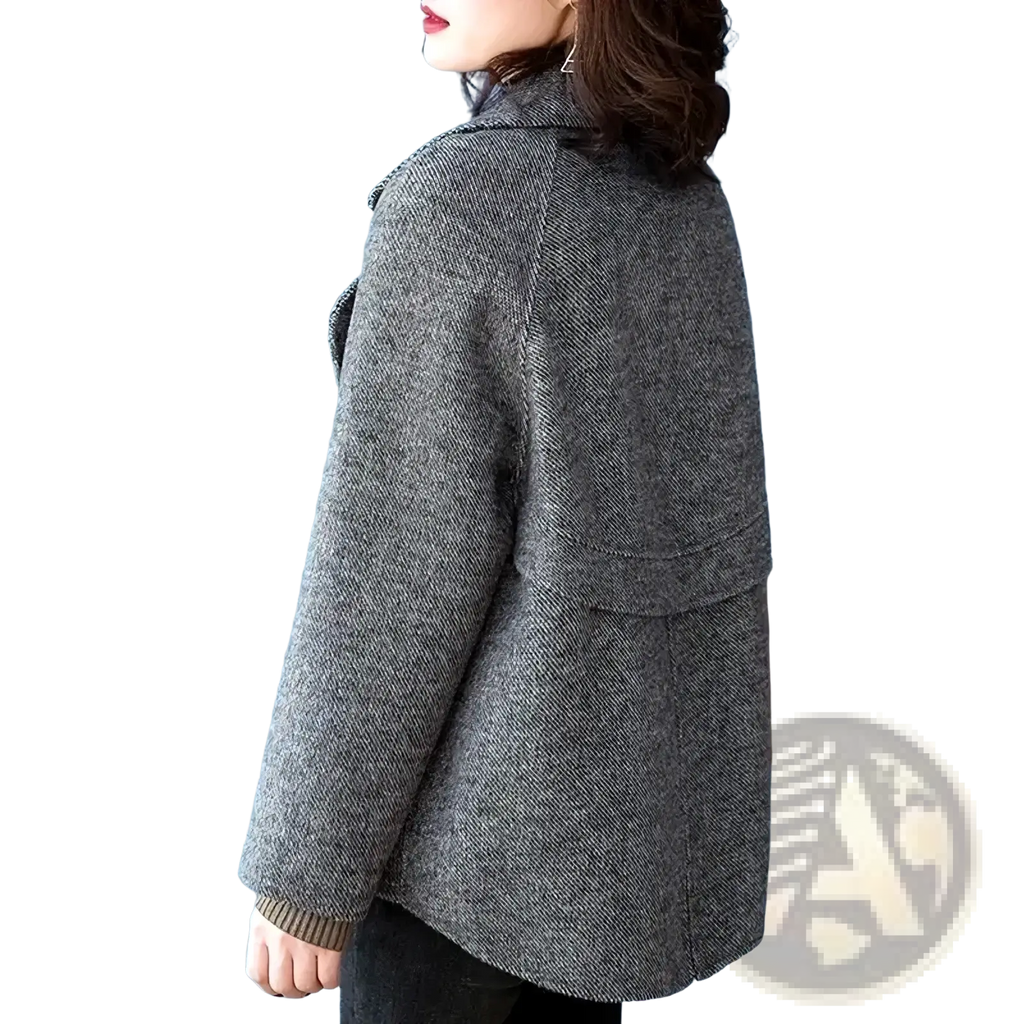 A stylish gray herringbone wool blend double breasted coat for women with ribbed cuffs and classic design