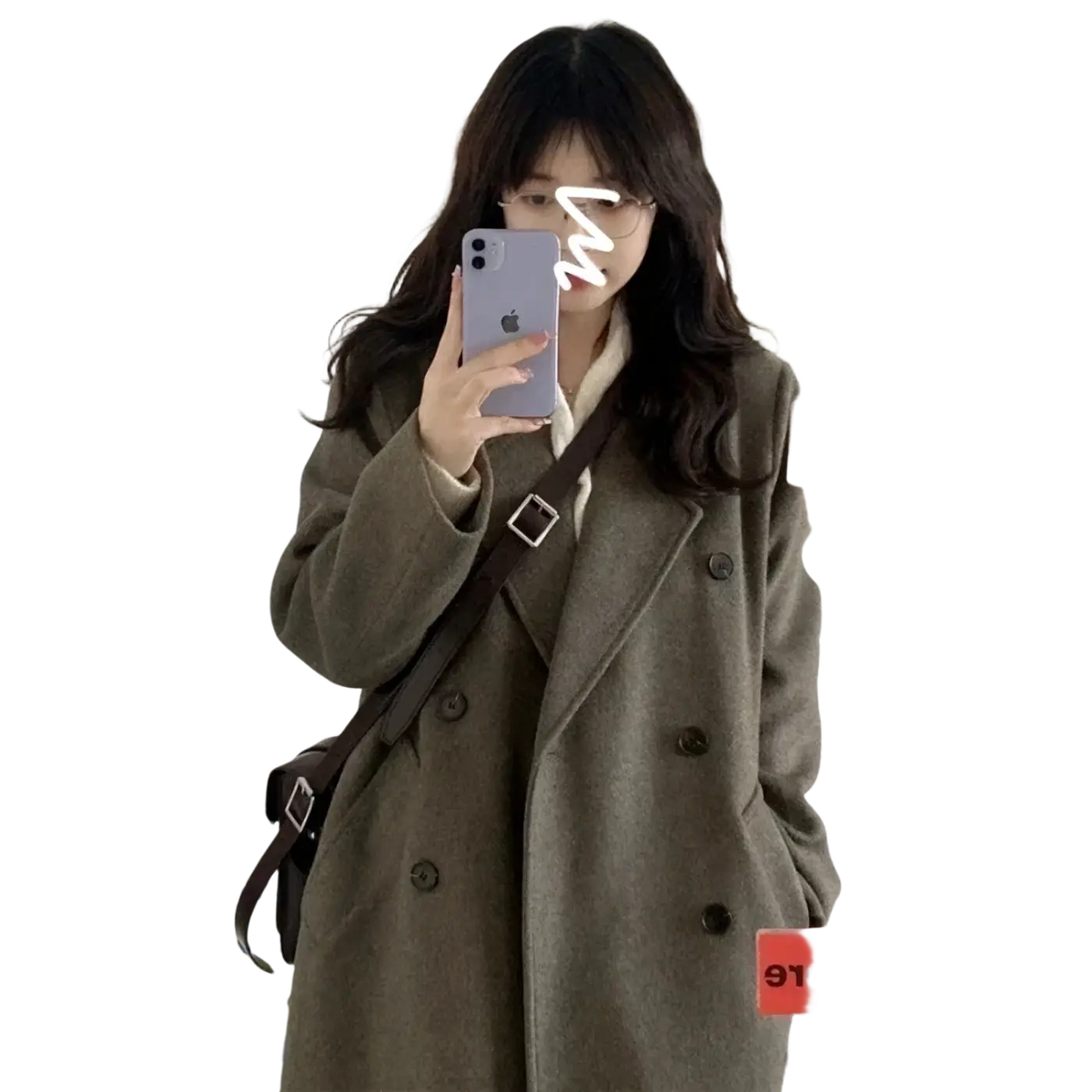 Brown leather crossbody bag with silver buckle and adjustable strap styled with wool blend midi coat