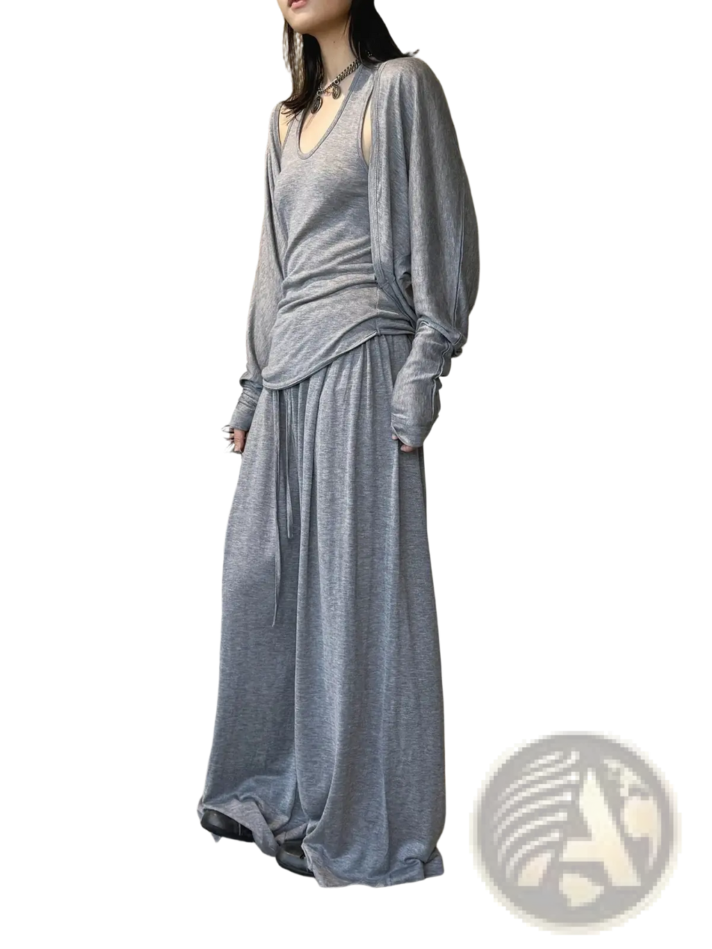 Gray knit wool blend two-piece set with long sleeves and flowing skirt featuring wide leg pants design